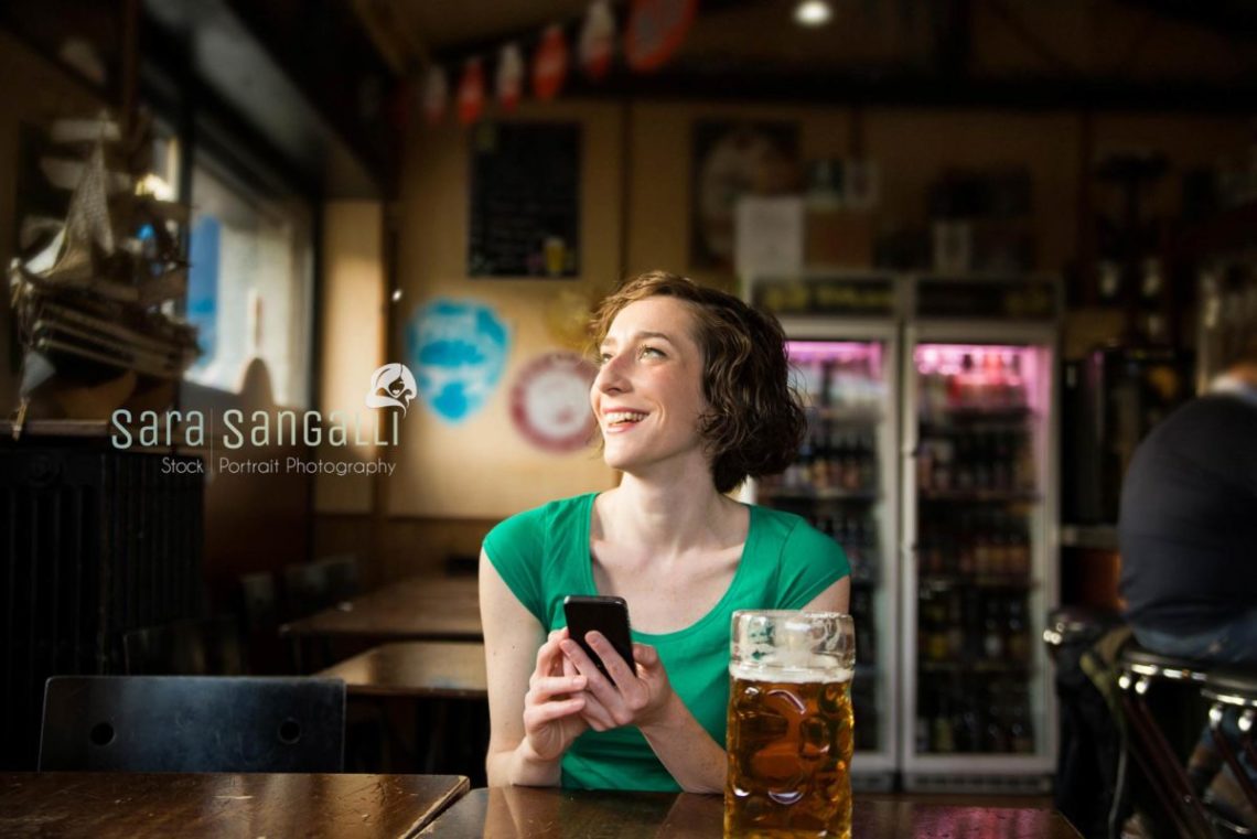 Young woman laughing and watching away from camera