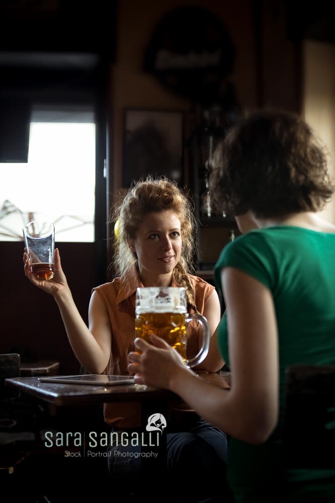 friends talking in front of a beer