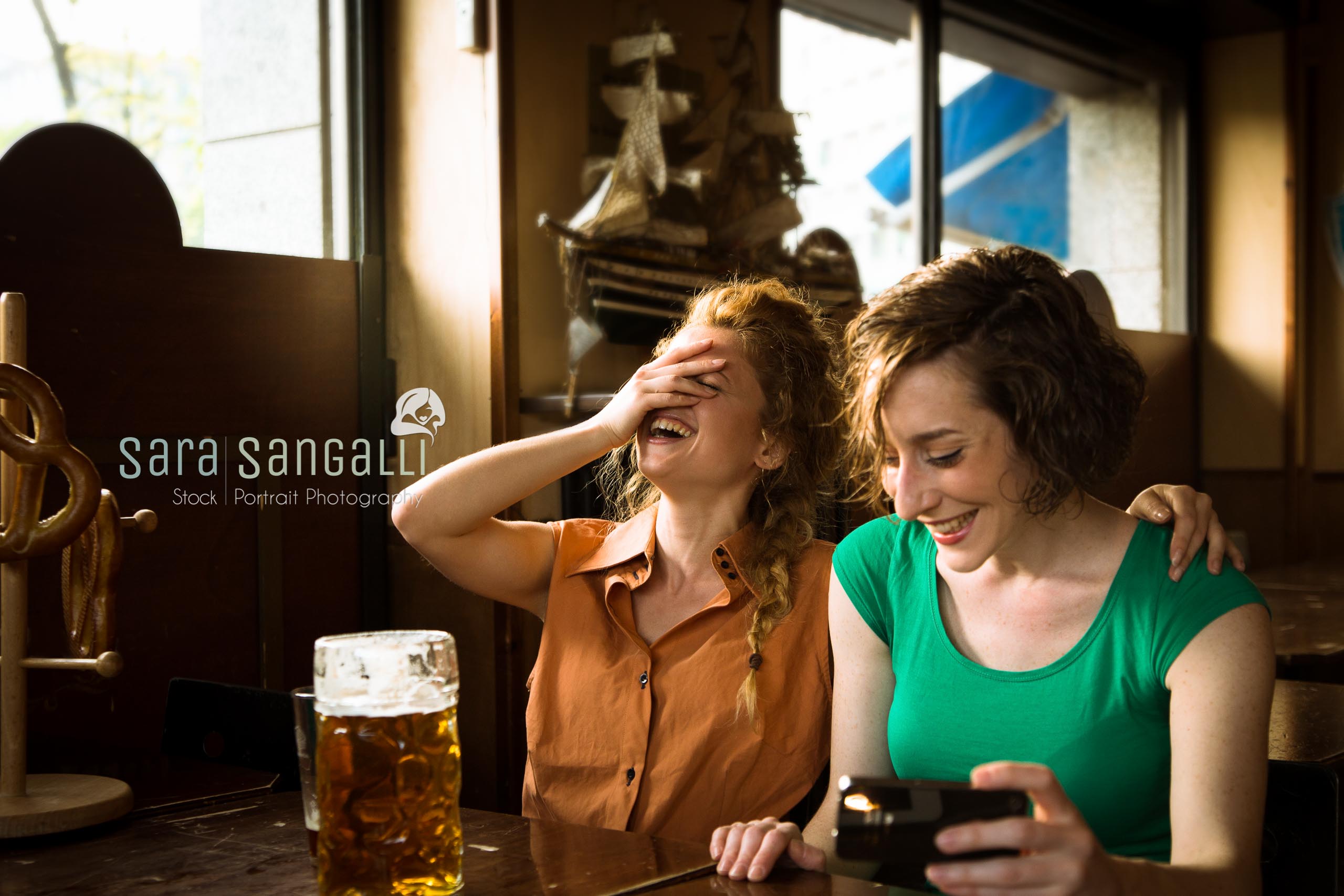 Friends getting together at the pub, drinking beer and having fun