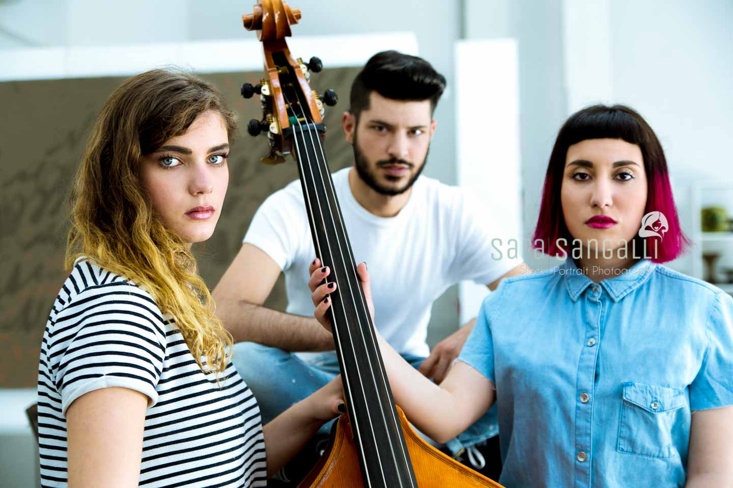 Rock band with their instruments in a loft.